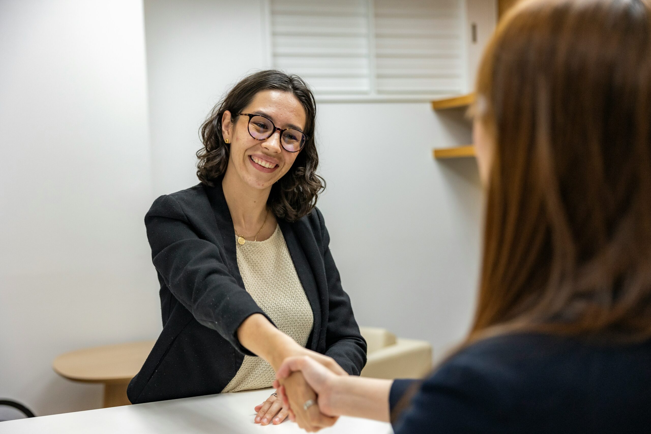 Successful Supply Teacher shaking hands after securing a job